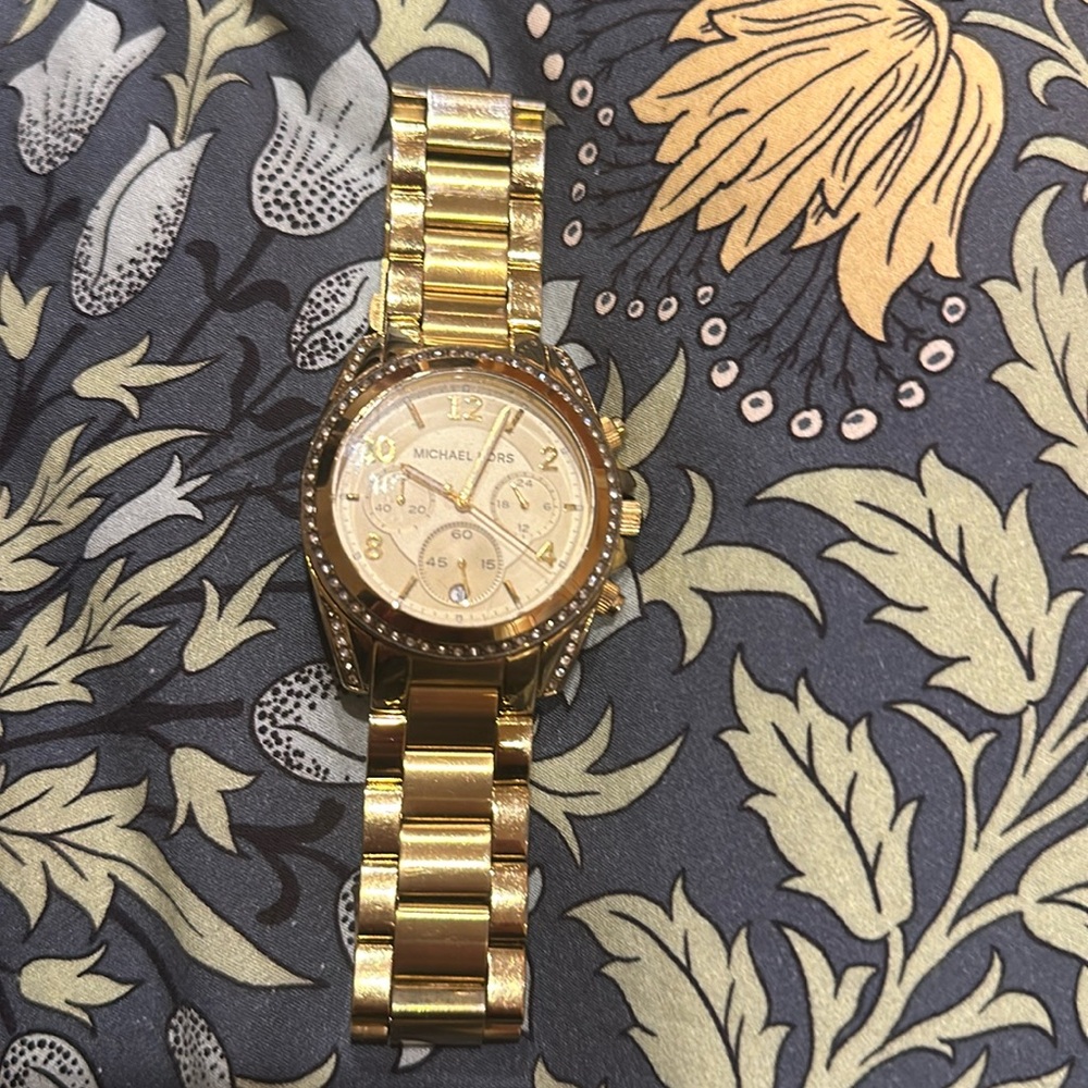 Micheal Kors watch. Gold band with cream dial and crystal accents.